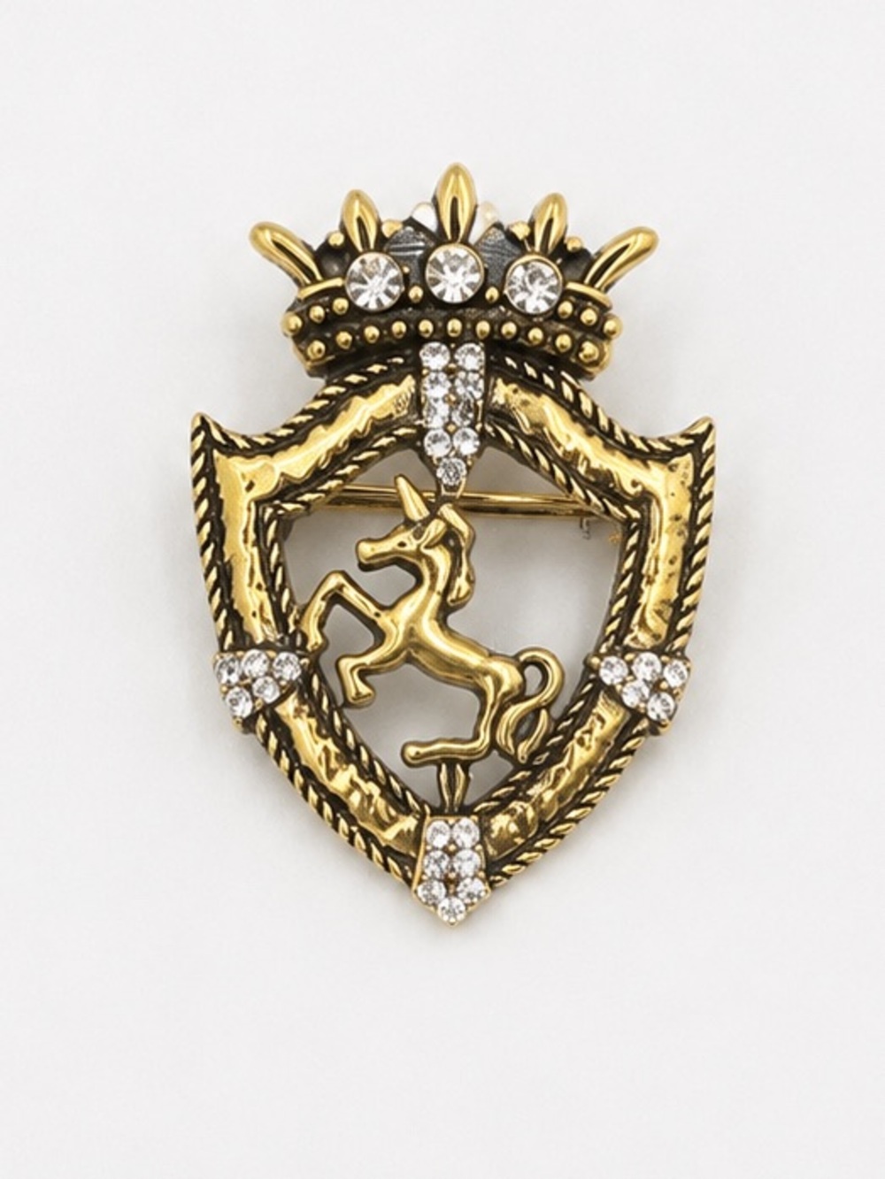 Shield and  horse brooch